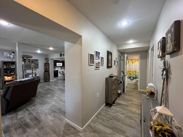 610 N Center St, Willow Springs, MO 65793 - hallway featuring baseboards and wood finished floors