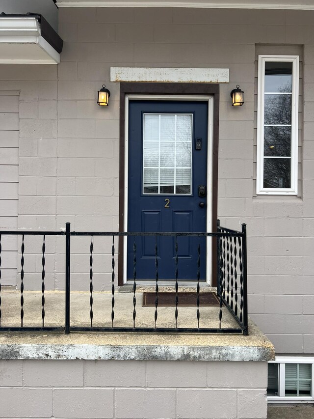 610 N Center St, Willow Springs, MO 65793 - doorway to property featuring concrete block siding