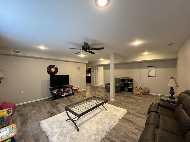 610 N Center St, Willow Springs, MO 65793 - living area featuring visible vents, baseboards, a ceiling fan, and wood finished floors