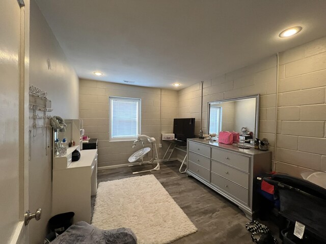 610 N Center St, Willow Springs, MO 65793 - bedroom featuring recessed lighting, concrete block wall, and dark wood-style flooring
