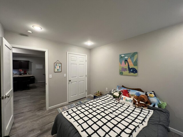 610 N Center St, Willow Springs, MO 65793 - bedroom featuring dark wood-type flooring and baseboards