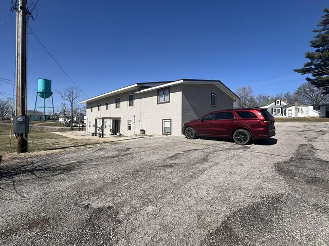 610 N Center St, Willow Springs, MO 65793 - view of side of home featuring concrete block siding