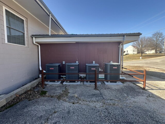 610 N Center St, Willow Springs, MO 65793 - exterior details with central AC unit and concrete block siding