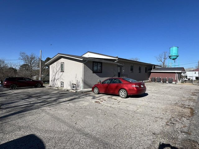610 N Center St, Willow Springs, MO 65793 - view of front of house featuring uncovered parking and brick siding