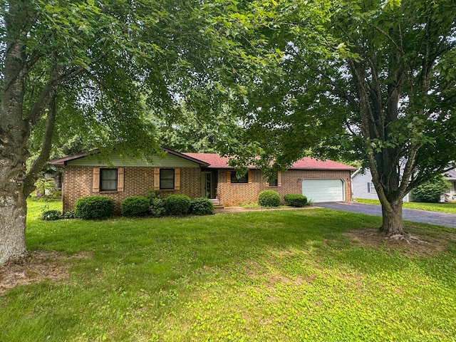 1203 N Hubbard St, Mountain Grove, MO 65711 - single story home featuring asphalt driveway, a front lawn, a garage, and brick siding