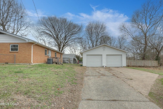 exterior space featuring central air condition unit, driveway, and fence