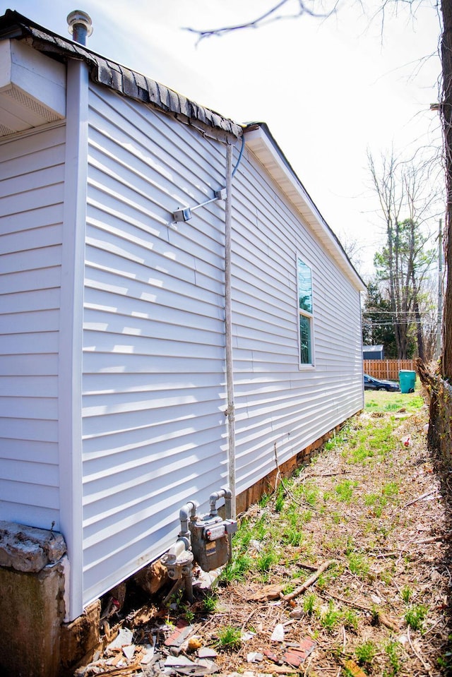 view of property exterior with fence