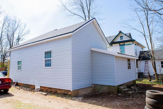 view of home's exterior featuring fence