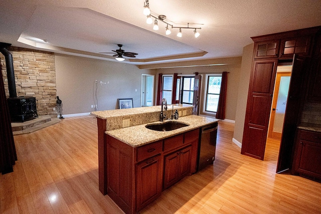 1618/1620 Tt, Bolivar, MO 65613 - kitchen featuring a tray ceiling, dishwashing machine, light wood-type flooring, ceiling fan, and a textured ceiling