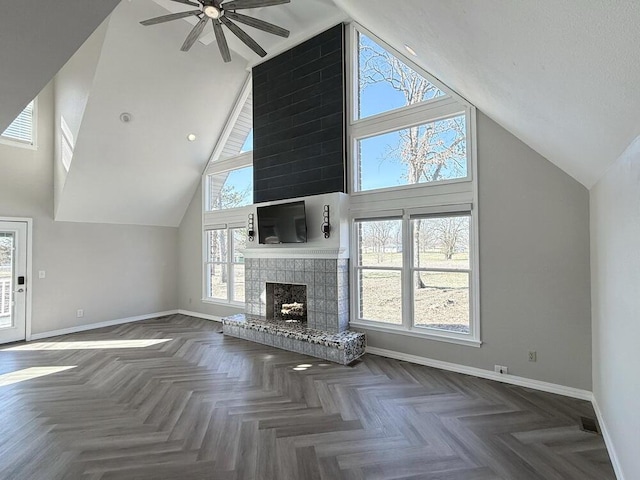3100 E 354th Rd, El Dorado Springs, MO 64744 - unfurnished living room featuring baseboards, ceiling fan, high vaulted ceiling, and a large fireplace