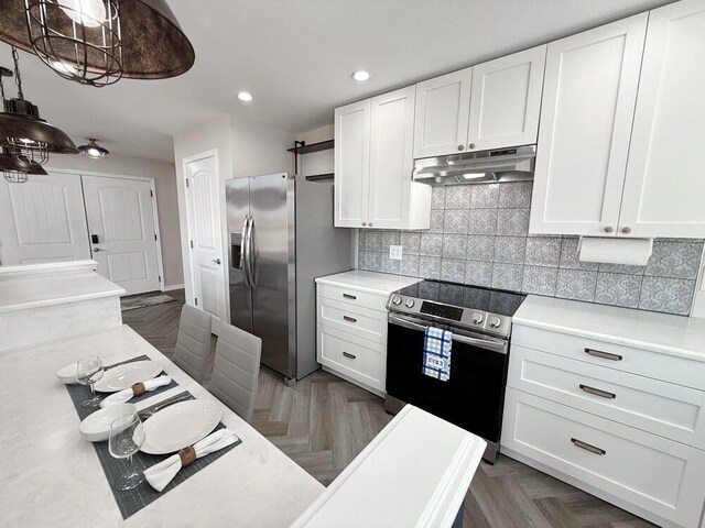 3100 E 354th Rd, El Dorado Springs, MO 64744 - kitchen featuring stainless steel appliances, under cabinet range hood, light countertops, white cabinets, and recessed lighting