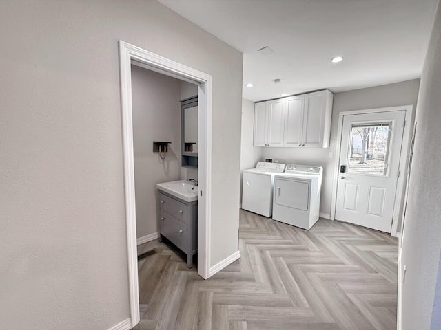 3100 E 354th Rd, El Dorado Springs, MO 64744 - washroom featuring cabinet space, washing machine and dryer, baseboards, and recessed lighting