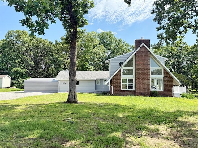 3100 E 354th Rd, El Dorado Springs, MO 64744 - view of side of property featuring a chimney, a yard, gravel driveway, and view of scattered trees