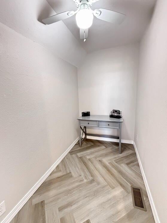 3100 E 354th Rd, El Dorado Springs, MO 64744 - spare room with baseboards, ceiling fan, and vaulted ceiling