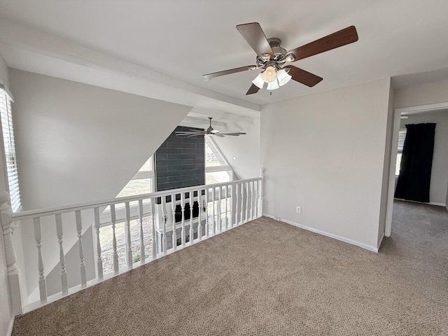 3100 E 354th Rd, El Dorado Springs, MO 64744 - spare room featuring a ceiling fan, carpet, and baseboards