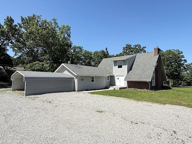 3100 E 354th Rd, El Dorado Springs, MO 64744 - view of front of property featuring driveway, a front lawn, and a chimney