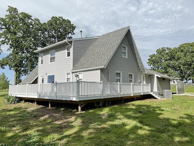 3100 E 354th Rd, El Dorado Springs, MO 64744 - rear view of property with roof with shingles, central AC, a deck, and a yard