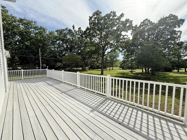 3100 E 354th Rd, El Dorado Springs, MO 64744 - wooden deck featuring a lawn and view of scattered trees
