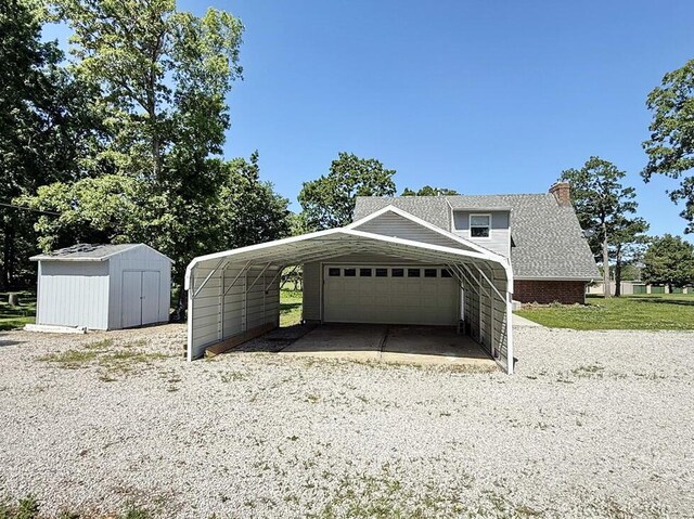 3100 E 354th Rd, El Dorado Springs, MO 64744 - garage featuring a storage shed and a garage