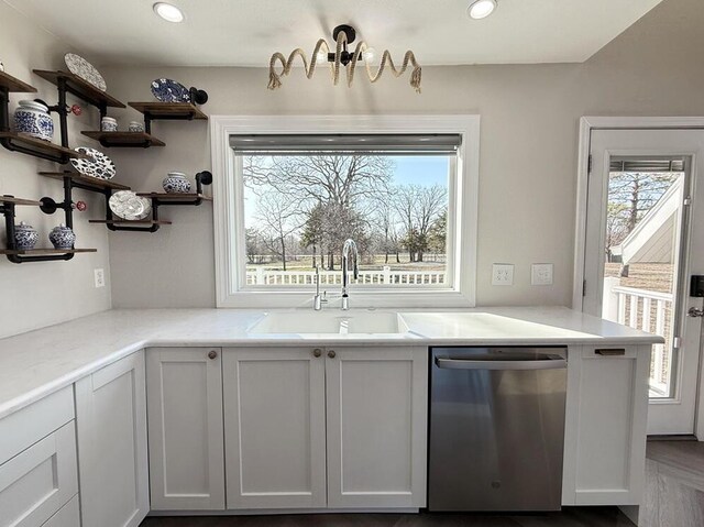 3100 E 354th Rd, El Dorado Springs, MO 64744 - kitchen with stainless steel dishwasher, a sink, light countertops, and recessed lighting