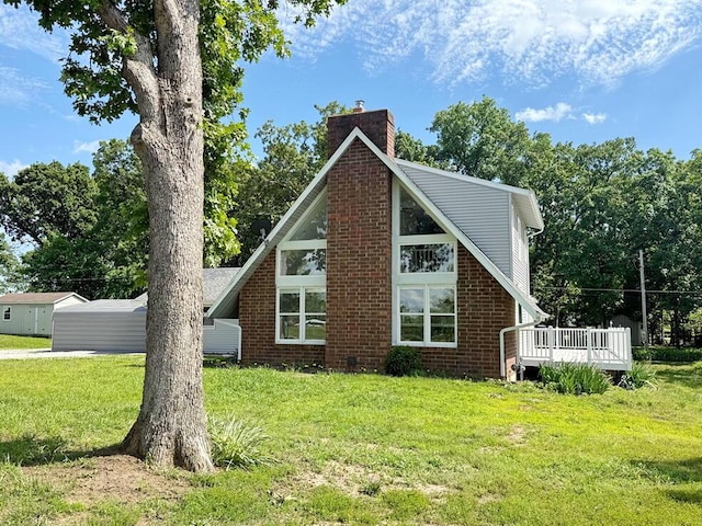 3100 E 354th Rd, El Dorado Springs, MO 64744 - back of house featuring a chimney, a lawn, and brick siding