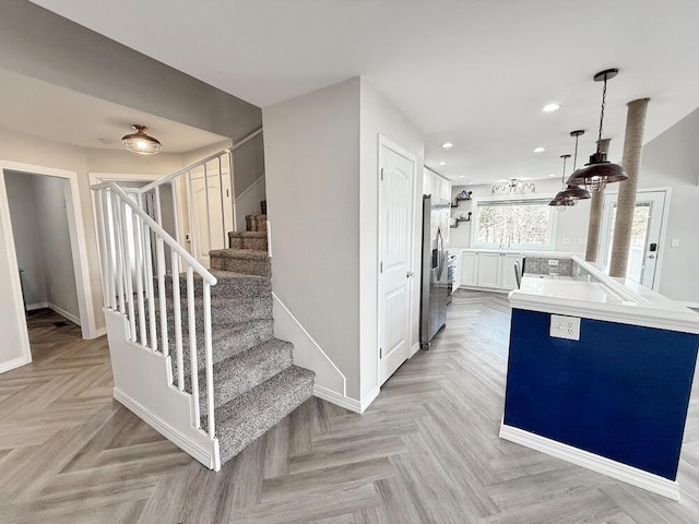 3100 E 354th Rd, El Dorado Springs, MO 64744 - kitchen featuring stainless steel refrigerator with ice dispenser, white cabinetry, recessed lighting, baseboards, and decorative light fixtures