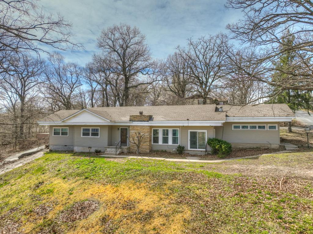 710 Chippewa St, Seneca, MO 64865 - rear view of property featuring crawl space, a lawn, and a chimney