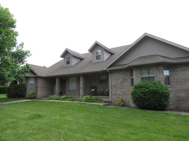 640 S Shuyler St, Republic, MO 65738 - view of front of property with brick siding, a front yard, and a shingled roof