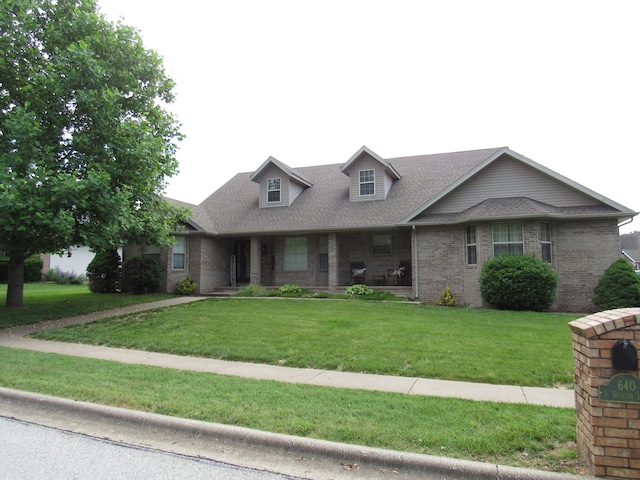 640 S Shuyler St, Republic, MO 65738 - view of front of property with brick siding, a front lawn, roof with shingles, and covered porch
