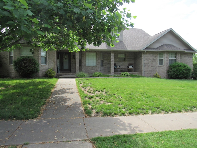 640 S Shuyler St, Republic, MO 65738 - view of front of home featuring a front yard, brick siding, and a shingled roof
