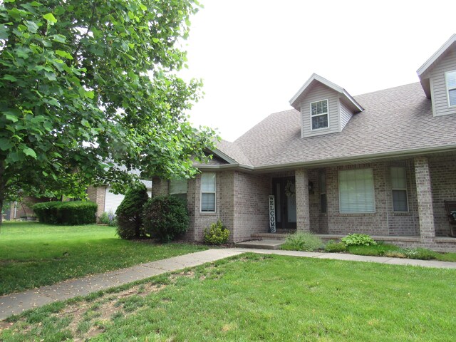 640 S Shuyler St, Republic, MO 65738 - view of front facade featuring brick siding, a front lawn, and a shingled roof
