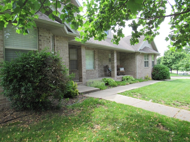 640 S Shuyler St, Republic, MO 65738 - view of front of house with a front lawn, brick siding, and roof with shingles