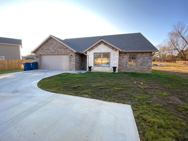 2520 S Schifferdecker Ave, Joplin, MO 64804 - view of front facade with a front yard, fence, stone siding, and driveway