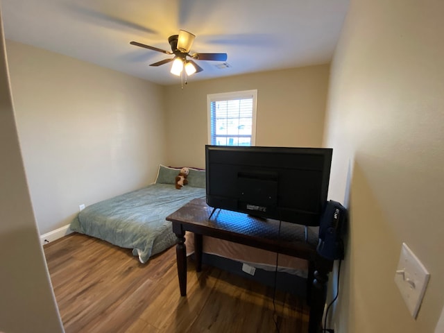 2520 S Schifferdecker Ave, Joplin, MO 64804 - bedroom with visible vents, baseboards, ceiling fan, and wood finished floors