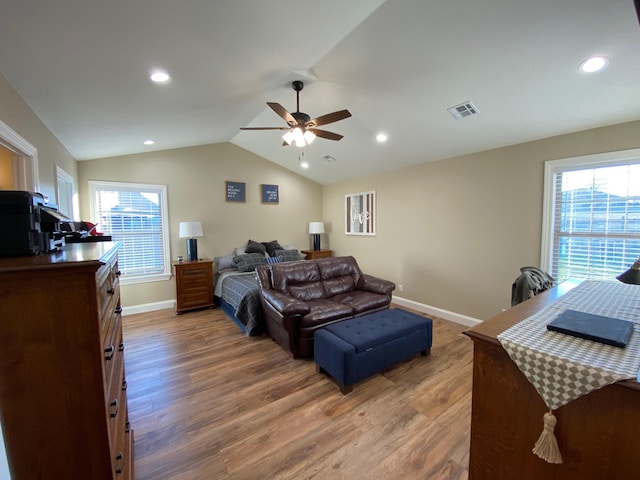 2520 S Schifferdecker Ave, Joplin, MO 64804 - bedroom featuring lofted ceiling, multiple windows, wood finished floors, and visible vents