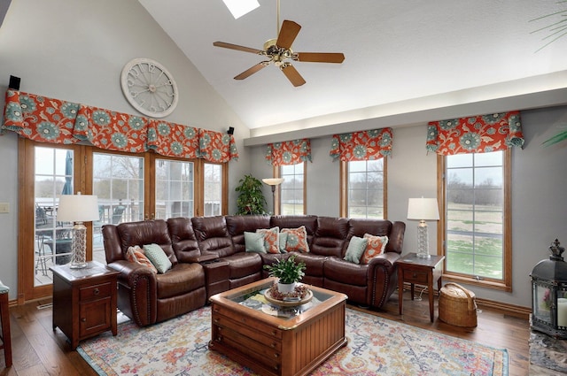 304 Reavley Dr, Lamar, MO 64759 - living room with a ceiling fan, baseboards, light wood finished floors, and high vaulted ceiling