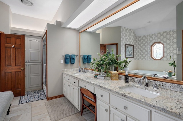 304 Reavley Dr, Lamar, MO 64759 - bathroom featuring wallpapered walls, double vanity, visible vents, and a sink