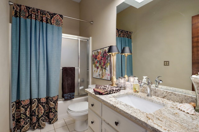 304 Reavley Dr, Lamar, MO 64759 - bathroom featuring tile patterned flooring, toilet, vanity, and bath / shower combo with glass door