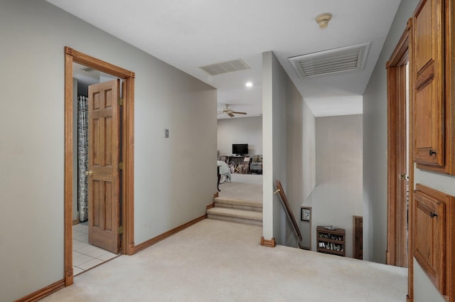 304 Reavley Dr, Lamar, MO 64759 - hallway featuring visible vents, light carpet, baseboards, and an upstairs landing