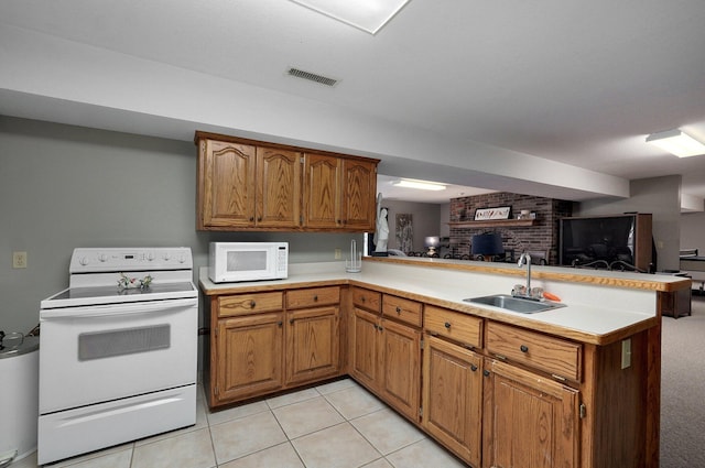 304 Reavley Dr, Lamar, MO 64759 - kitchen featuring white appliances, visible vents, a peninsula, a sink, and open floor plan