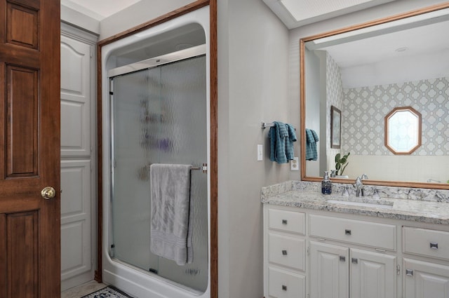 304 Reavley Dr, Lamar, MO 64759 - full bathroom with a stall shower, vanity, and wallpapered walls