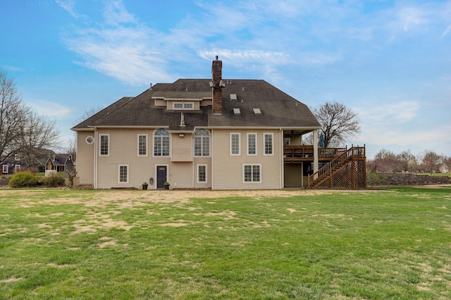 304 Reavley Dr, Lamar, MO 64759 - back of house featuring a lawn, a chimney, stairs, and a deck