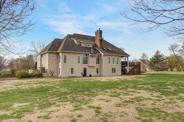 304 Reavley Dr, Lamar, MO 64759 - rear view of property with a yard, a wooden deck, a chimney, and stairway