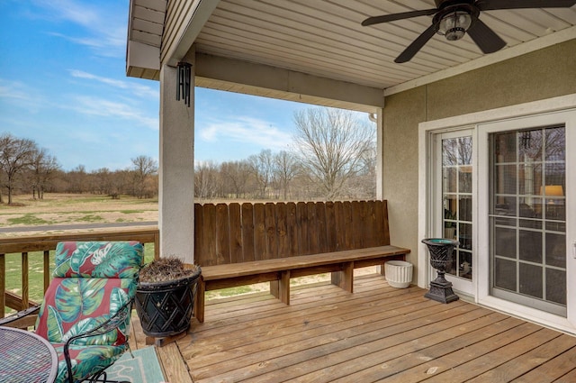 304 Reavley Dr, Lamar, MO 64759 - wooden deck featuring a ceiling fan and fence