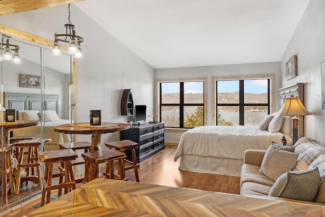 bedroom with lofted ceiling and parquet flooring