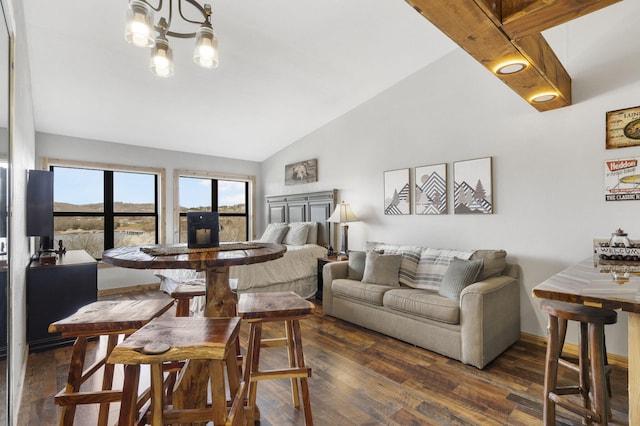 dining space featuring an inviting chandelier, lofted ceiling, wood finished floors, and baseboards