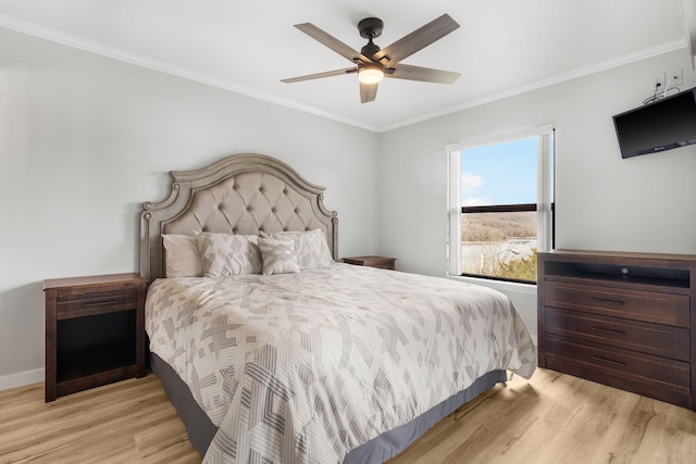 bedroom with a ceiling fan, wood finished floors, baseboards, and ornamental molding