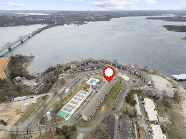 birds eye view of property with a water view