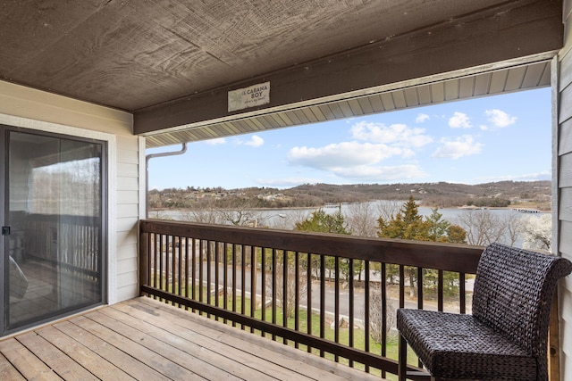 wooden deck with a water view