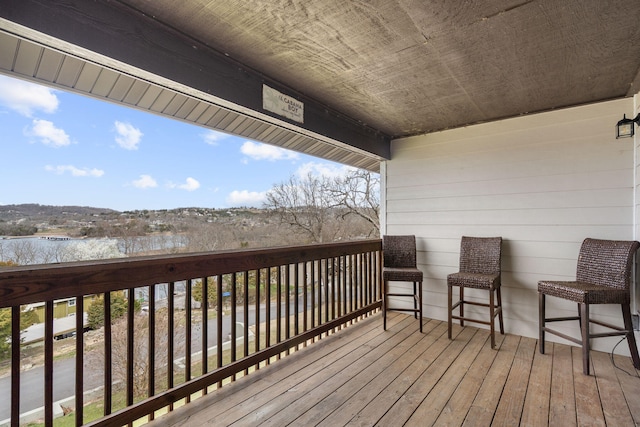 wooden terrace with a water view